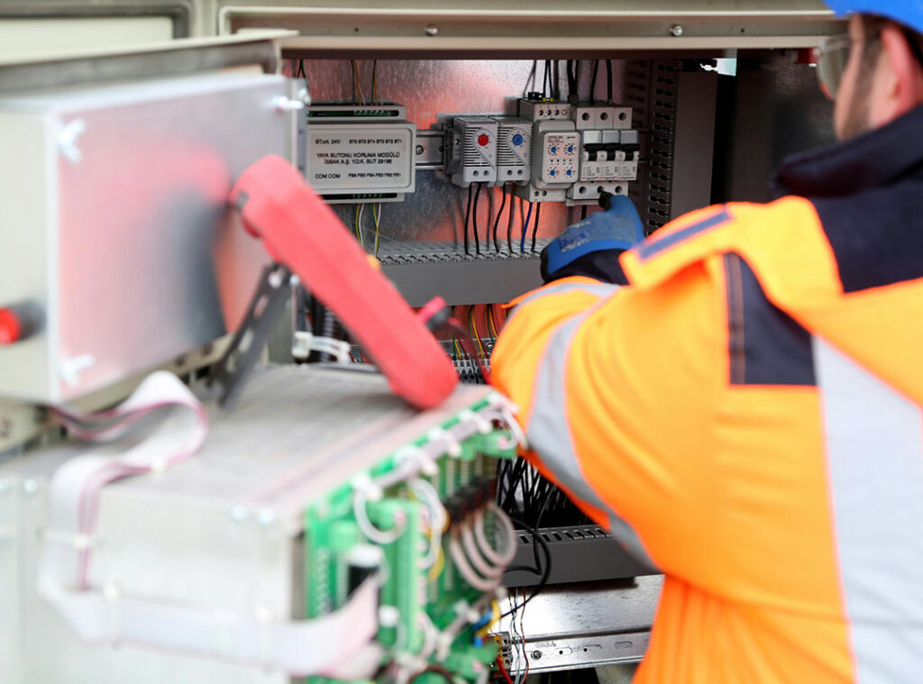 Electrician working with cables